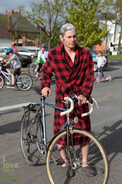 man dressed as old man with bike
