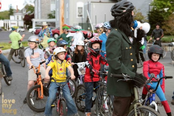 children on bikes lining up for parade