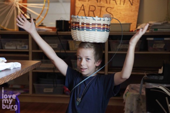 kid with basket on head