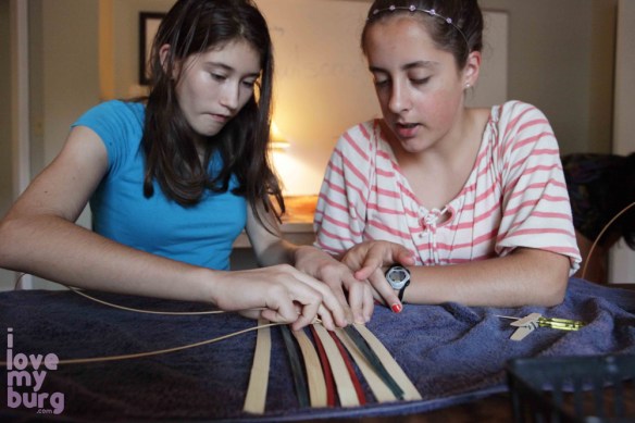 girls weaving pouch basket