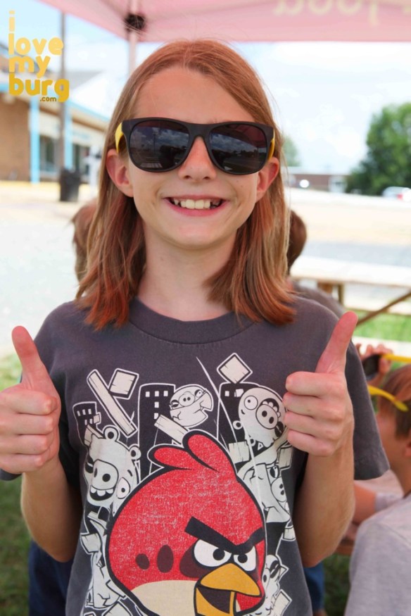 kid smiling with glasses