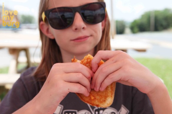 girl eating grilled cheese
