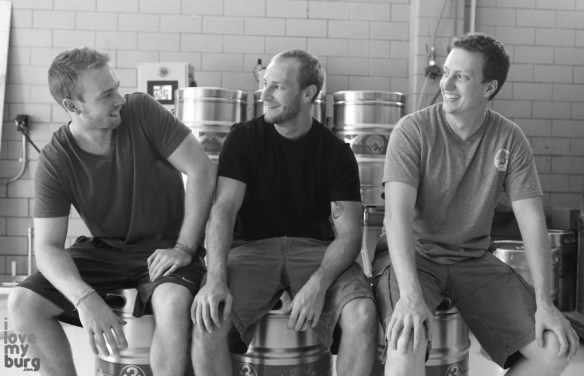 three men on kegs