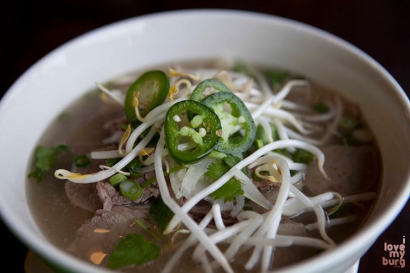 SOUP BOWLS. Rice noodles and beef, with basil, jalapeños, lime, and bean sprouts served on the side. 